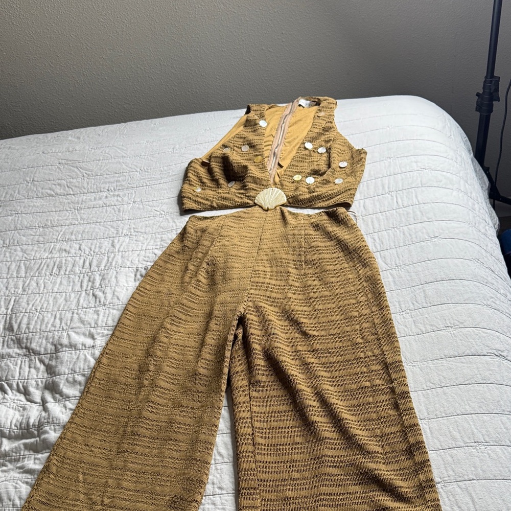 Elegant Brown Jumpsuit with Shell Accents open sides and all back.